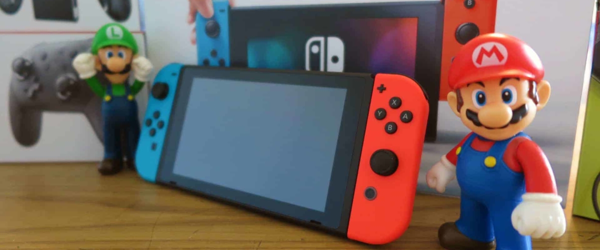 Nintendo Switch with Mario character figurines