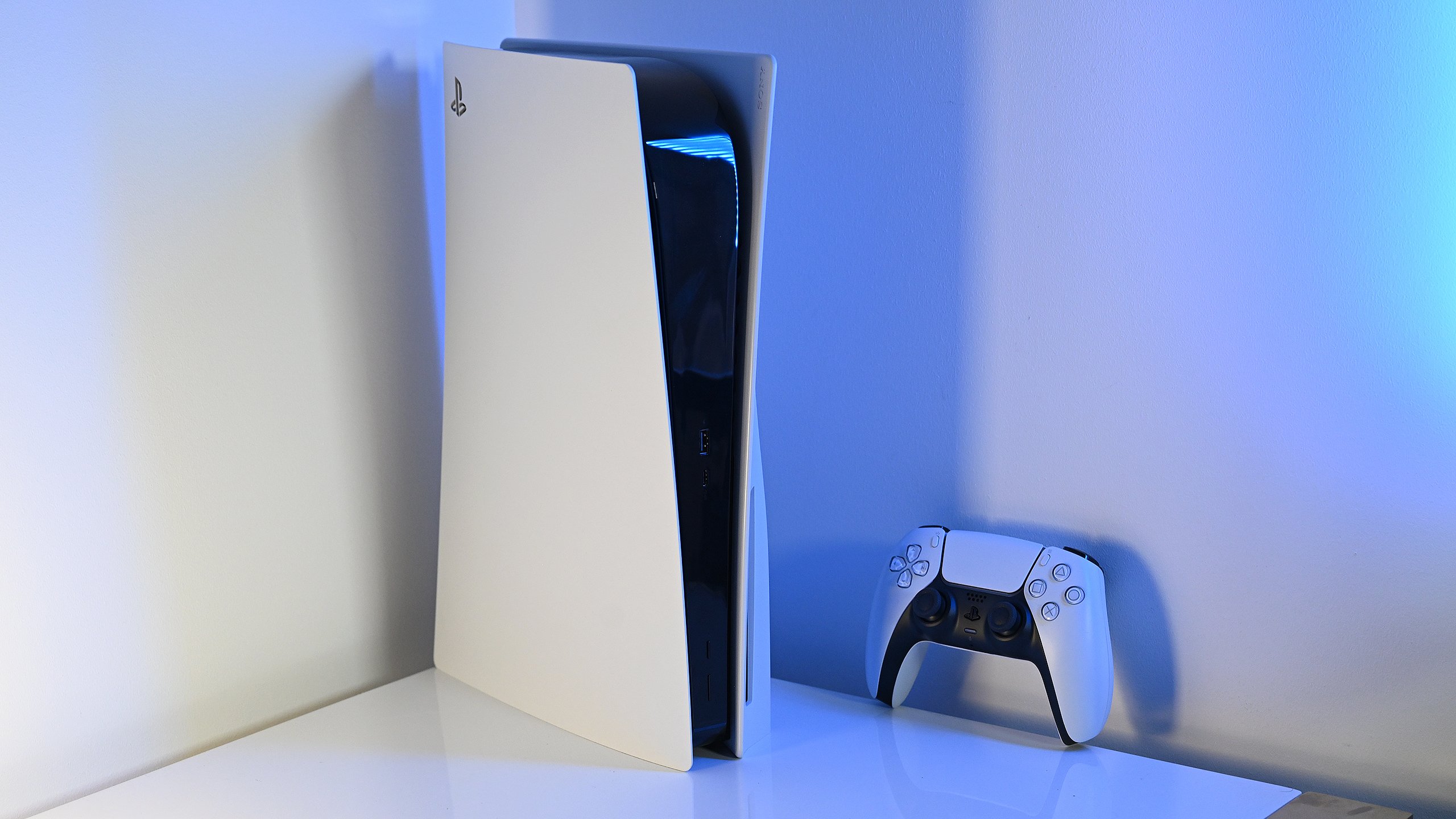 PlayStation 5 in corner with blue backlight